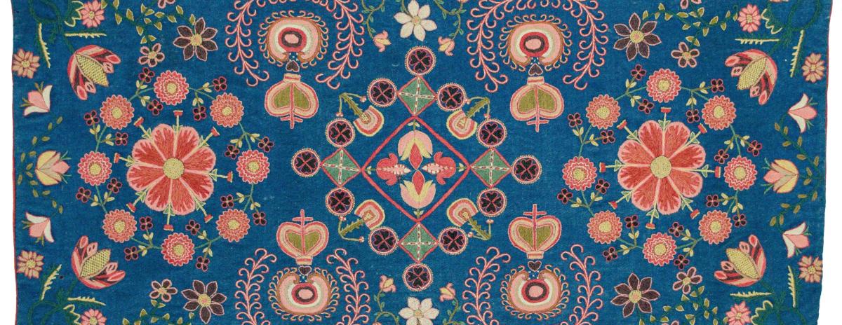Embroidered agedyna (bench cushion), 19th century, with blue ground, polychrome segmented medallions, hearts, crosses, and floral motifs. Scania, Sweden. Collection of Wendel and Diane Swan.