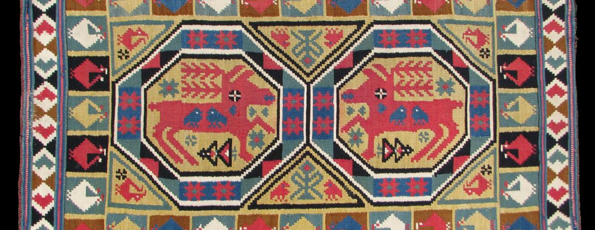 rollakan two reindeer in octagons woven fabric featuring two reindeer in octagon shapes