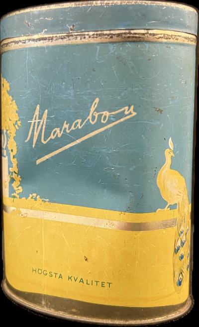 An early example of a Marabou candy storage tin with fanciful urns, peacocks, and the colors of the Swedish flag. Collection of Tyler Graybeal.