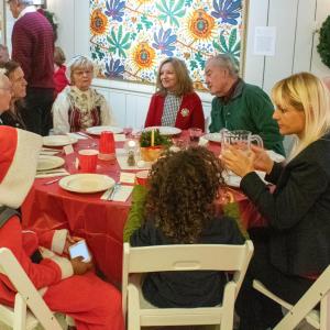 family at a table eating dinner