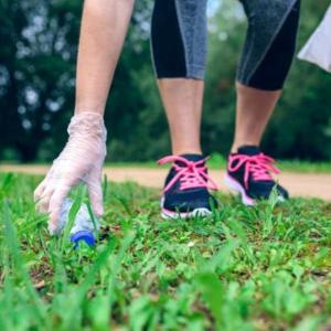 jogger picking up trash