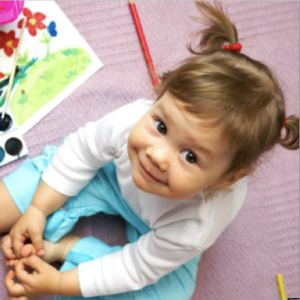 Child with watercolor paints