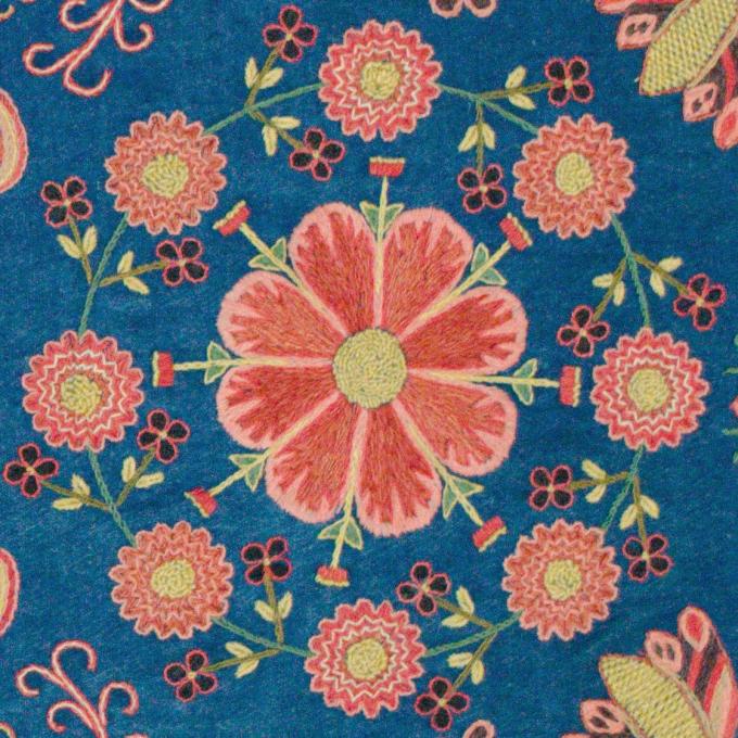Embroidered agedyna (bench cushion), 19th century, with blue ground, polychrome segmented medallions, hearts, crosses, and floral motifs. Scania, Sweden. Collection of Wendel and Diane Swan.