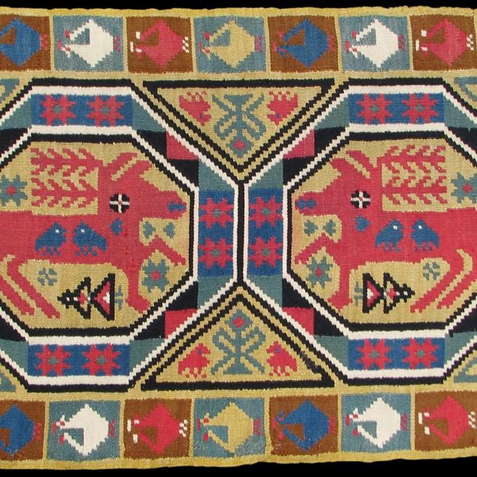 woven fabric featuring two reindeer in octagon shapes